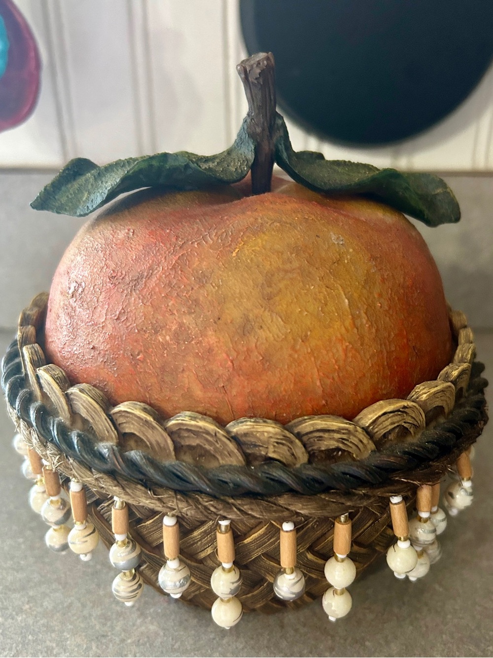 Decorative peach Fruit Accent in Woven Bead Basket storage container